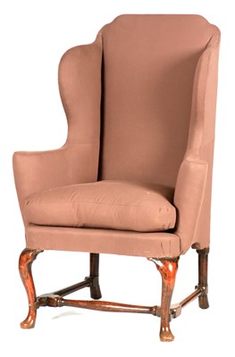 Lot 1028 - A QUEEN ANNE WALNUT WING-BACK UPHOLSTERED...