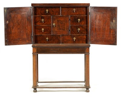 Lot 1042 - A WILLIAM AND MARY FIGURED WALNUT FITTED...