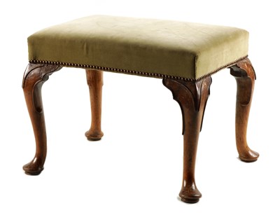Lot 1057 - A GEORGE II WALNUT STOOL with upholstered top...