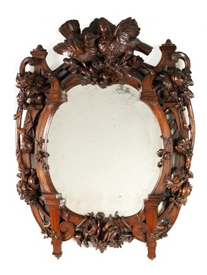 Lot 1119 - A 19TH CENTURY WALNUT BLACK FOREST CARVED...