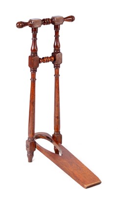Lot 1123 - A 19TH CENTURY WALNUT BOOT JACK with turned...