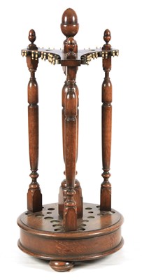 Lot 1144 - A LATE 19TH/ EARLY 20TH CENTURY REVOLVING OAK...