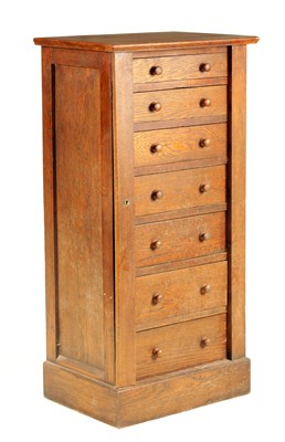 Lot 1164 - A LATE 19TH CENTURY OAK WELLINGTON CHEST with...