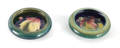 Lot 134 - TWO MOORCROFT SHALLOW SMALL DISHES WITH CURVED...