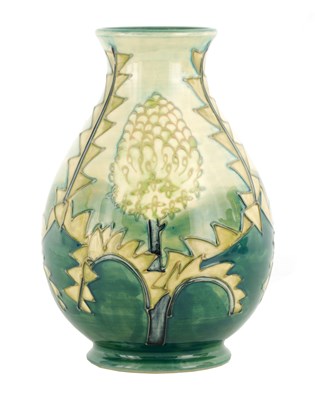 Lot 172 - A WILLIAM MOORCROFT FOOTED OVOID VASE DESIGNED...