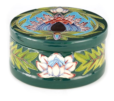 Lot 192 - A MOORCROFT LARGE CIRCULAR LIDDED BOX tube...