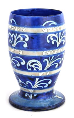 Lot 24 - AN UNUSUAL MOORCROFT FOOTED OVOID VASE...