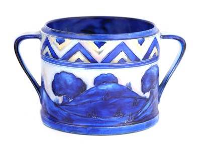 Lot 25 - A MOORCROFT TWO HANDLED CYLINDRICAL BISCUIT...