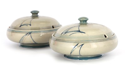 Lot 29 - A PAIR OF MOORCROFT LIDDED TABLE TUREENS...