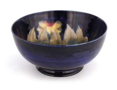 Lot 35 - A MOORCROFT BURSLEM FOOTED BOWL decorated in...