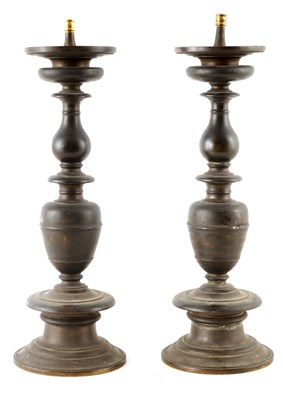 Lot 577 - A PAIR OF EARLY 17TH CENTURY BRONZE PRICKET...