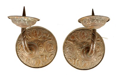Lot 578 - A PAIR OF ARTS AND CRAFTS PRICKET STICK WALL...