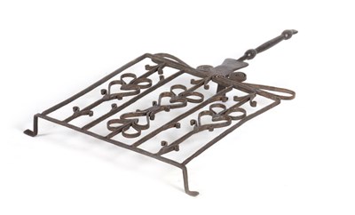 Lot 588 - A 17TH CENTURY IRONWORK OVERSIZED TRIVET with...