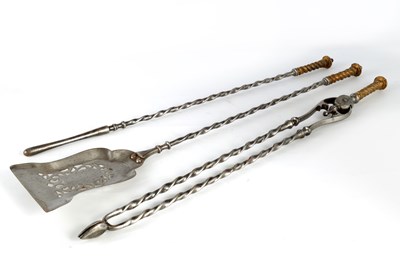 Lot 589 - A SET OF REGENCY STEEL AND BRASS FIRE IRONS...