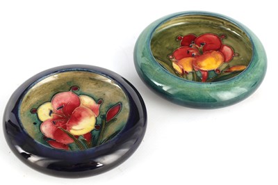 Lot 64 - TWO MOORCROFT SHALLOW SMALL DISHES WITH CURVED...