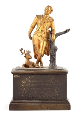 Lot 691 - A REGENCY PATINATED BRONZE AND GILT BRONZE...