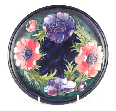 Lot 76 - A LATE WALTER MOORCROFT SHALLOW DISH tube...