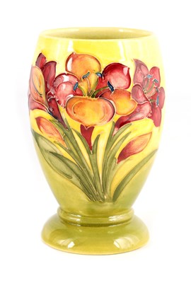 Lot 81 - A WALTER MOORCROFT SMALL FOOTED OVOID VASE...