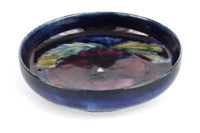 Lot 83 - A MOORCROFT BURSLEM SHALLOW DISH decorated in...