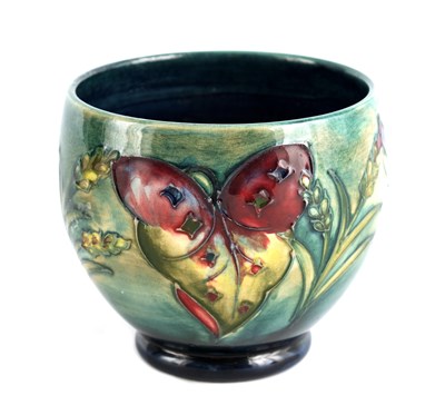 Lot 90 - A WALTER MOORCROFT SQUAT FOOTED VASE tube...