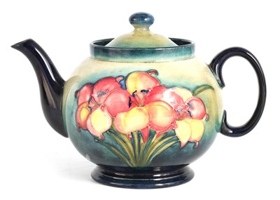 Lot 97 - A WALTER MOORCROFT LARGE BULBOUS TEAPOT tube...
