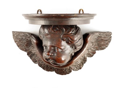 Lot 972 - A 17TH CENTURY CARVED OAK WINGED CHERUB HEAD...