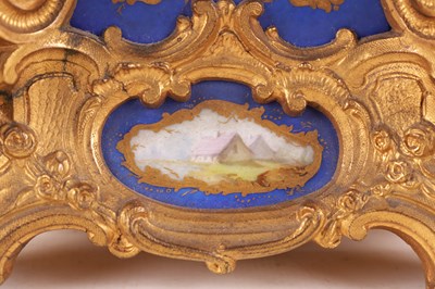 Lot 778 - DROCOURT (CIRCA 1860)  A FINE AND RARE MID 19TH CENTURY FRENCH GILT BRASS AND SEVRES STYLE PORCELAIN PANELLED ROCOCO REPEATING CARRIAGE CLOCK
