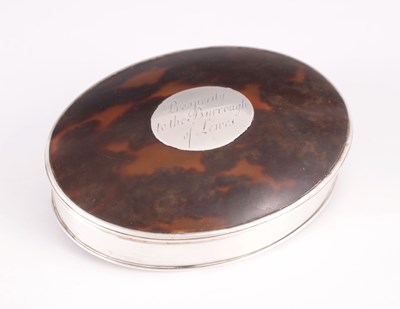 Lot 210 - A 19TH CENTURY SILVER AND TORTOISESHELL OVAL-SHAPED DRESSING TABLE BOX