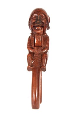 Lot 452 - A 19TH CENTURY BLACK FOREST FRUITWOOD NUTCRACKER