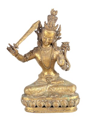 Lot 175 - A GILT BRONZE TIBETAN MANJUSHRI SEATED BUDDHA
