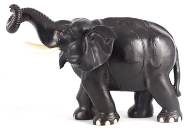 Lot 224 - A LARGE LATE 19TH CENTURY ANGLO-INDIAN CARVED EBONY ELEPHANT