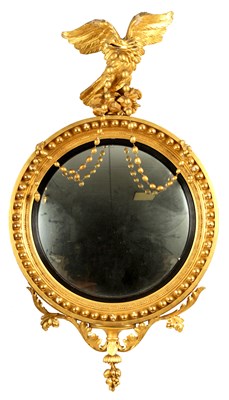 Lot 1026 - A REGENCY CARVED GILTWOOD CONVEX MIRROR OF LARGE SIZE