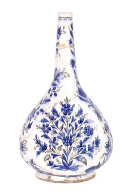 Lot 168 - AN EARLY EASTERN/PERSIAN BLUE AND WHITE EARTHENWARE SLENDER NECK VASE