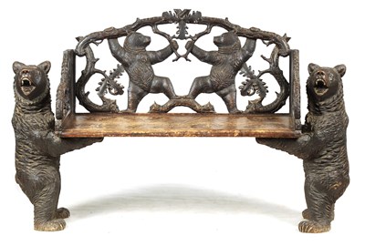 Lot 450 - A 19TH CENTURY BLACK FOREST CARVED TWO SEATER HALL BENCH