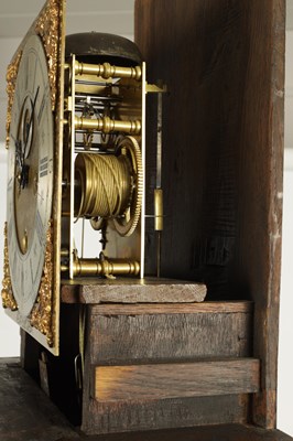 Lot 953 - JOSEPH WINDMILLS, LONDON AN EARLY 18TH CENTURY 11” BRASS DIAL BURR WALNUT LONGCASE CLOCK