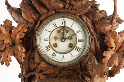 Lot 794 - A LARGE LATE 19TH CENTURY CARVED BLACK FOREST MANTEL CLOCK
