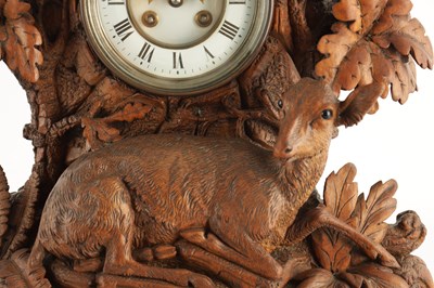 Lot 794 - A LARGE LATE 19TH CENTURY CARVED BLACK FOREST MANTEL CLOCK