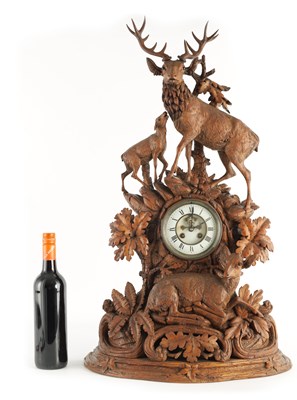 Lot 794 - A LARGE LATE 19TH CENTURY CARVED BLACK FOREST MANTEL CLOCK