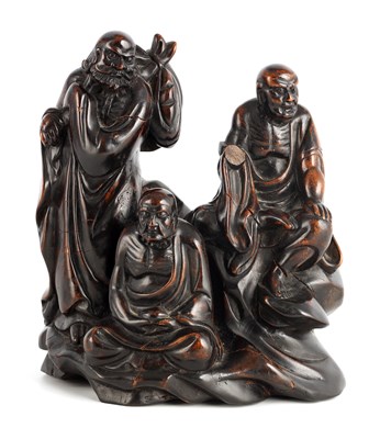Lot 75 - AN EARLY CHINESE CARVED HEAVY HARDWOOD FIGURAL SCULPTURE
