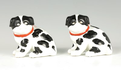 Lot 33 - A PAIR OF CONTINENTAL SEATED PUG DOGS