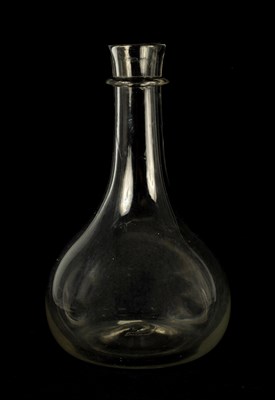 Lot 10 - A LARGE GEORGIAN BULBOUS CLEAR GLASS WINE CARAFE