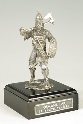 Lot 309 - A CAST SILVER FIGURE OF A KNIGHT