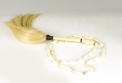 Lot 465 - A 19TH CENTURY CARVED IVORY MASK HEAD HANDLED SWISH