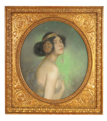 Lot 703 - CLEMENS VON PAUSINGER (Austrian, 1855-1936)  AN ART NOUVEAU OVAL PASTEL BUST PORTRAIT OF A STYLISH YOUNG LADY ‘SOLOME’