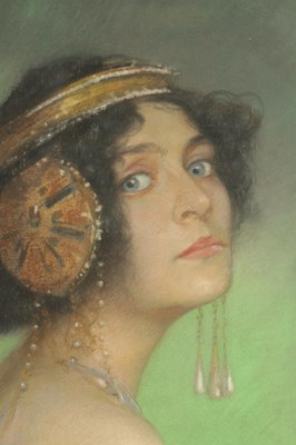 Lot 703 - CLEMENS VON PAUSINGER (Austrian, 1855-1936)  AN ART NOUVEAU OVAL PASTEL BUST PORTRAIT OF A STYLISH YOUNG LADY ‘SOLOME’