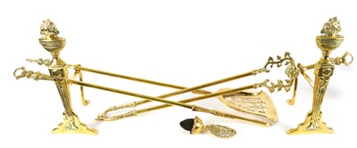 Lot 1151 - A SET OF LATE 19TH CENTURY BRASS FIRE-IRONS  AND HEARTH DOGS