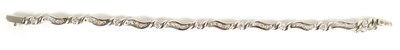 Lot 247 - A LADIES 18CT WHITE GOLD DIAMOND ENCRUSTED BRACELET