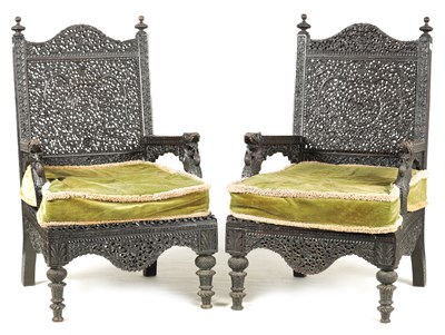 Lot 170 - A PAIR OF 19TH CENTURY INDIAN CARVED HARDWOOD ARMCHAIRS