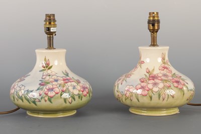 Lot 61 - A PAIR OF MOORCROFT LAMPS IN THE SPRING BLOSSOM DESIGN