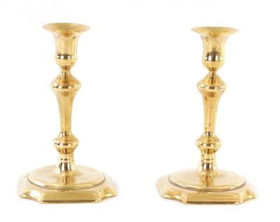 Lot 337 - A PAIR OF MID 18TH CENTURY CAST BRASS CANDLESTICKS